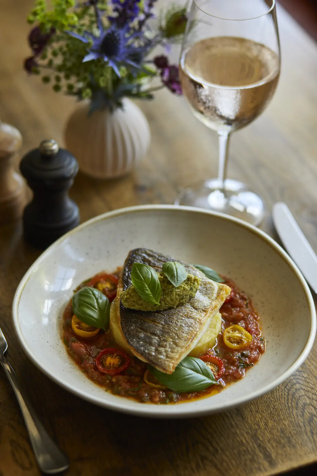 Sea bass on tomato and basil